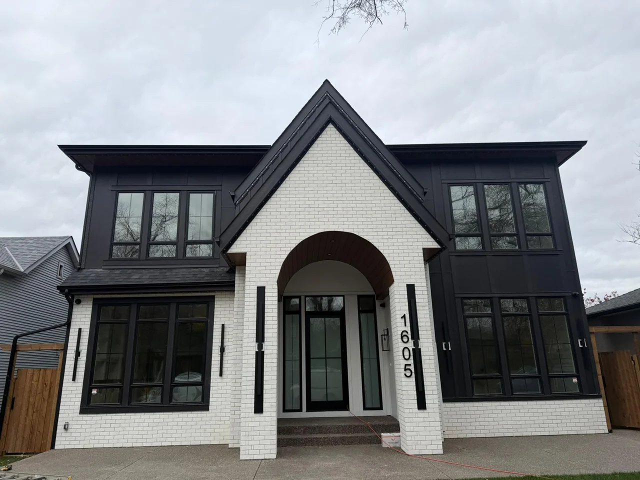 White masonry and dark house exterior