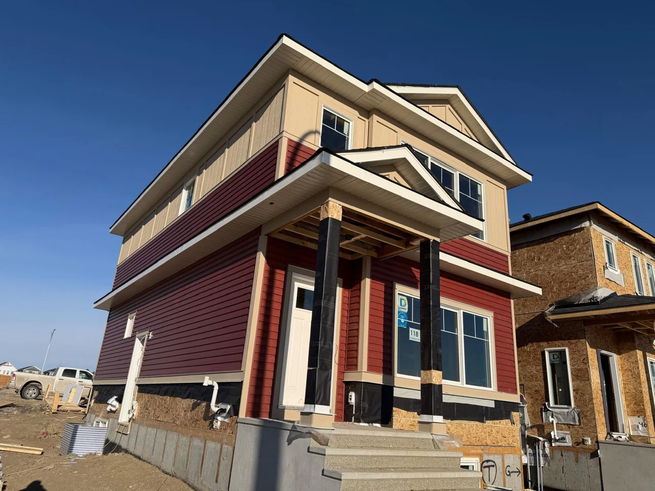 Red horizontal siding during construction